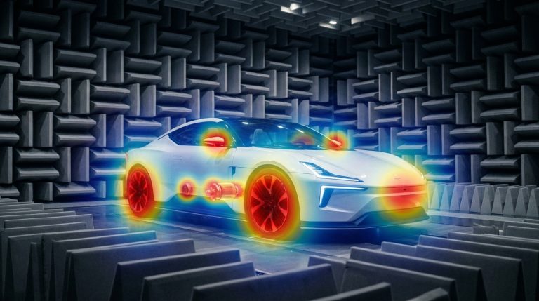 Electric vehicle in anechoic chamber with acoustic beamforming heatmap overlay